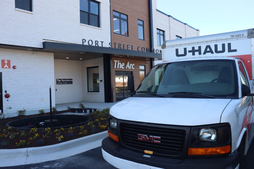 Tenants using a U-Haul truck to move into the Residences at Port Street Commons